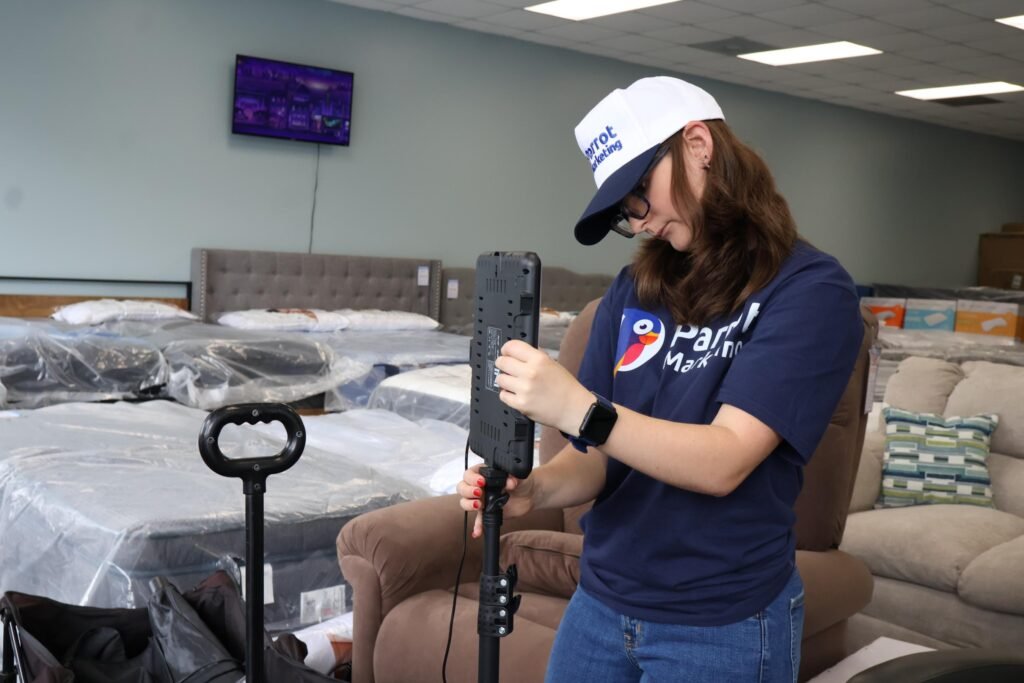 Parrot Marketing team member filming social media content with a stabilizer inside a local store