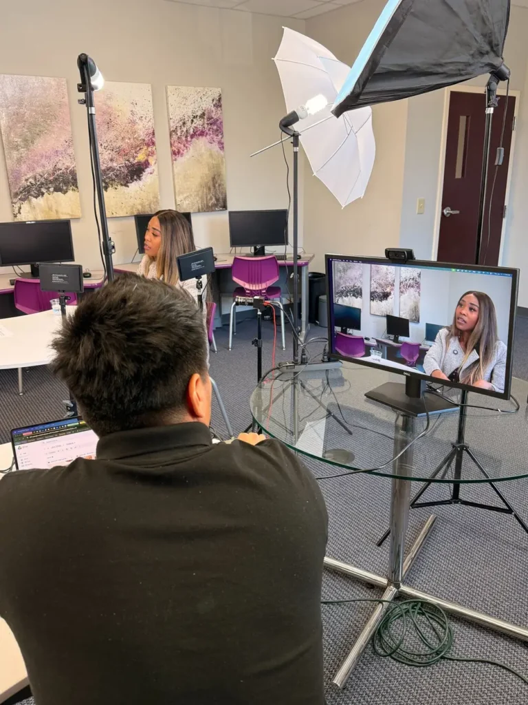 Video recording session with lights and live monitor at a Henry County business
